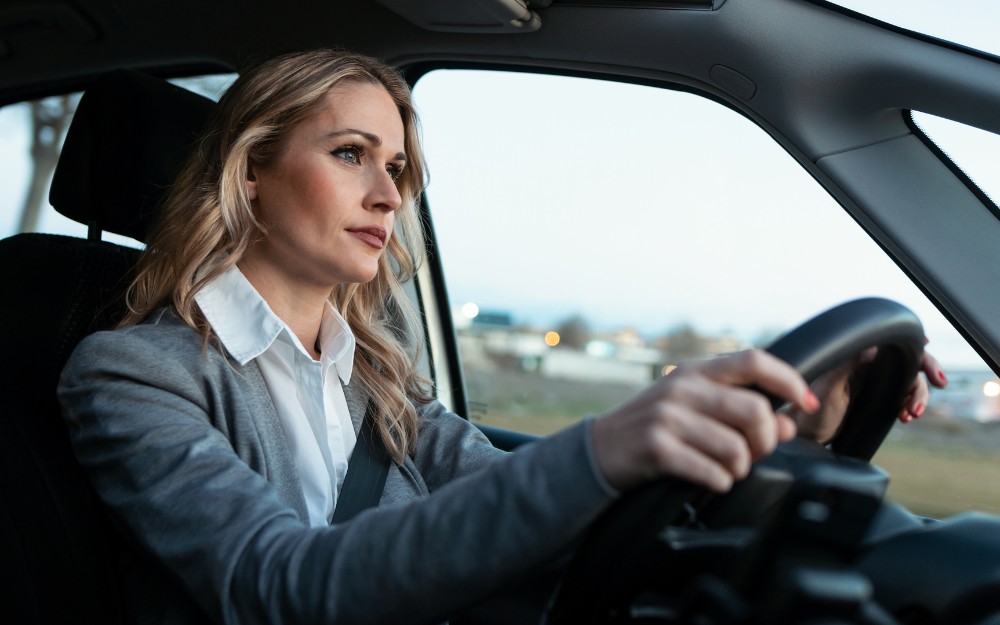 Woman driving car on her way to work, aware of CTP insurance claims for compensation in Queensland