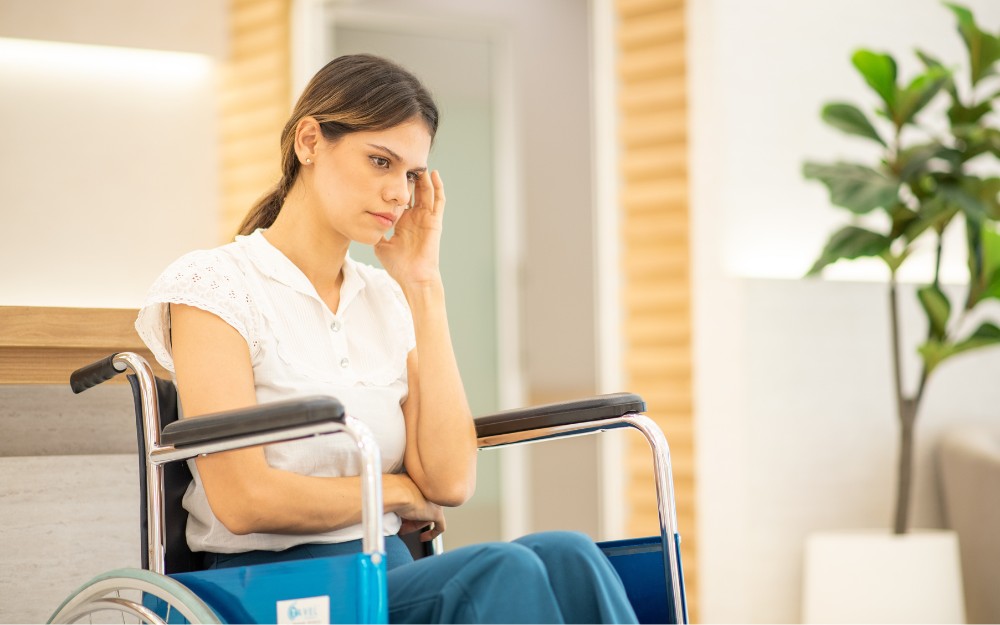 Woman with physical injury whose recovery is affected by psychological and emotional strain